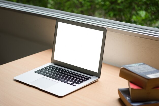 Computer laptop and old vintage book