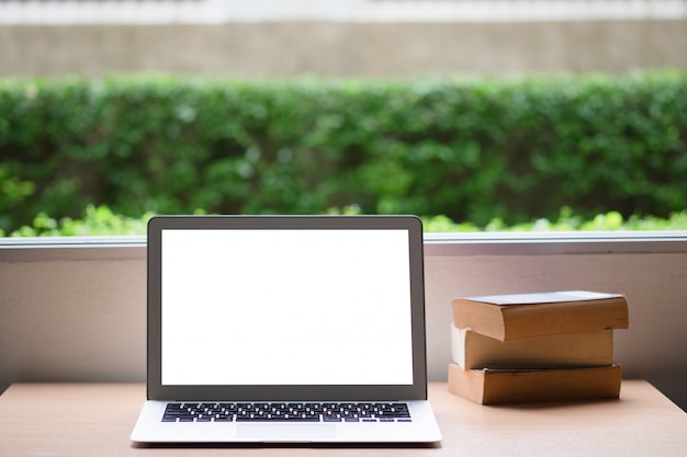 Computer laptop and old vintage book