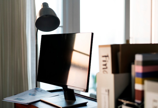 Computer monitor on wooden table