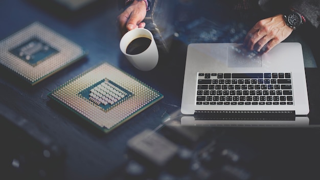 Computer programmer using a laptop