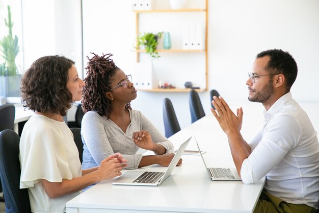 Concentrated business people talking