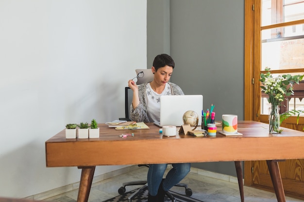 Concentrated businesswoman working in the office