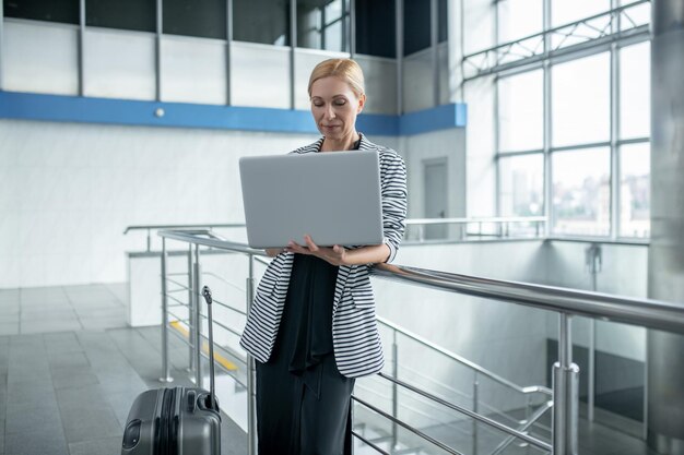 Concentrated busy female entrepreneur working on her laptop