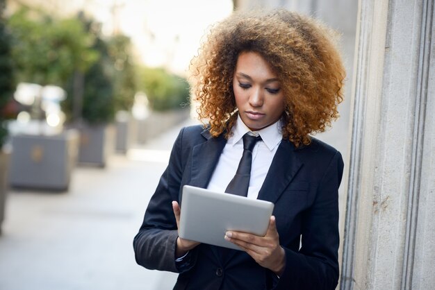 Concentrated employee with tablet 