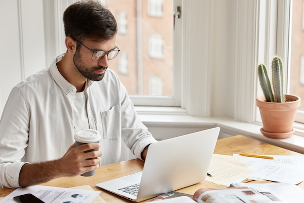 Concentrated male executive manager working at home