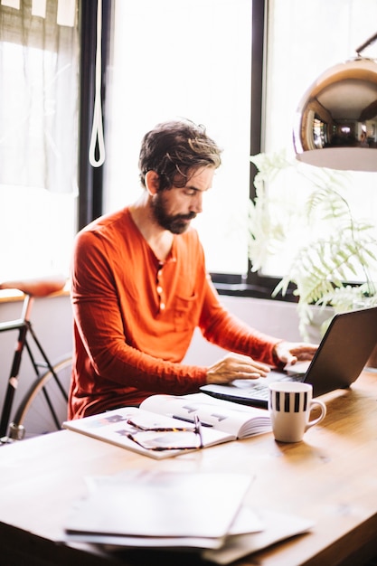 Concentrated male worker in stylish office