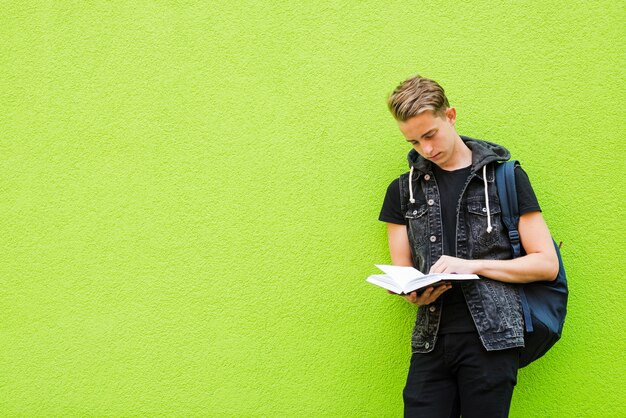 Concentrated man reading book