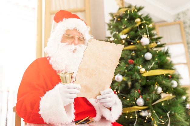 Concentrated Santa Claus reading letter