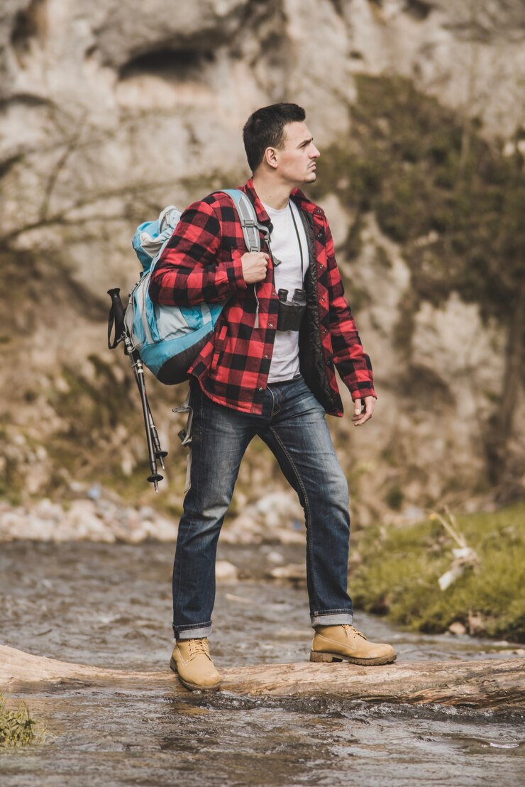 Free Photo concentrated traveler crossing the river