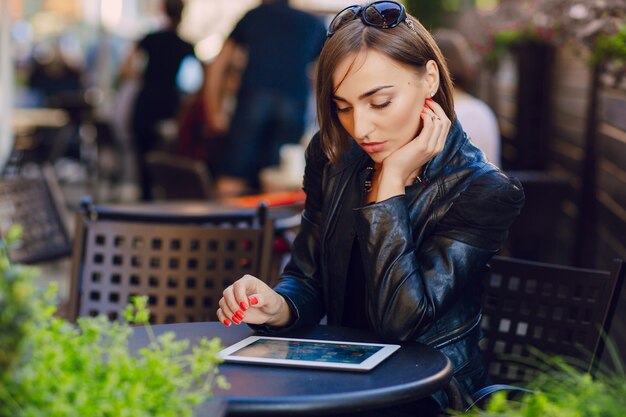 Concentrated woman working with her tablet