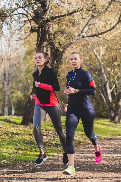 Concentrated women training outdoors