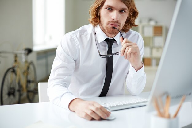 Concentrated worker thinking over financial results