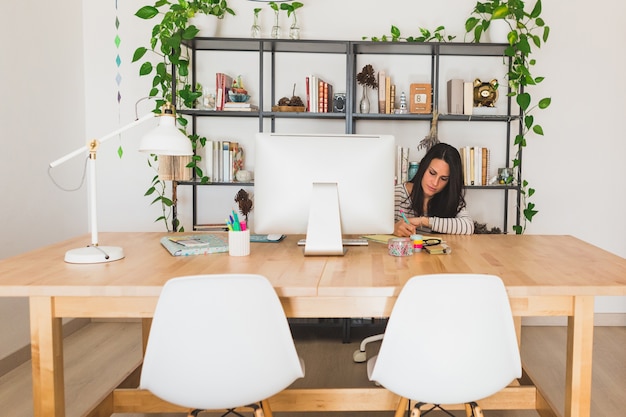 Concentrated young businesswoman working in the office