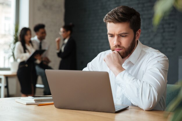 Concentrated young caucasian businessman