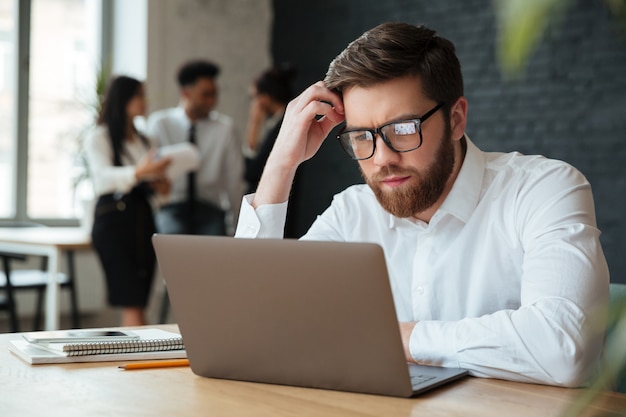 Concentrated young caucasian businessman