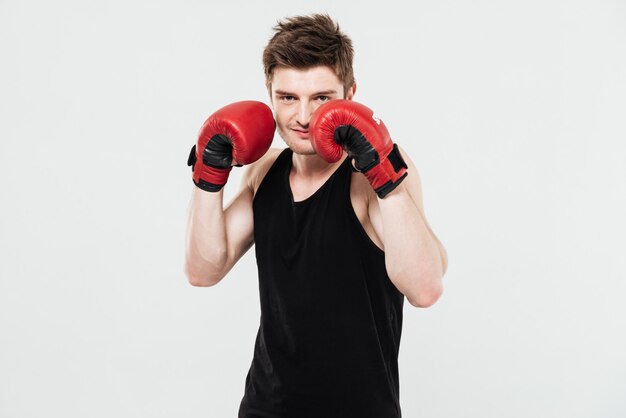 Concentrated young sportsman boxer