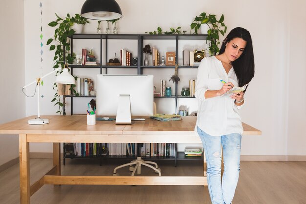 Concentrated young woman in her modern office