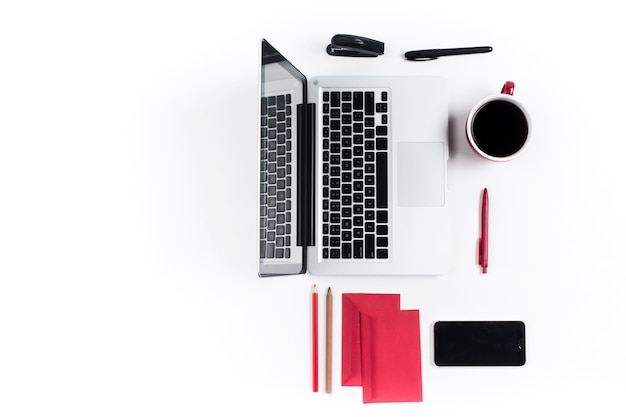 Concept of comfortable workplaces. Gadgets on the white desk