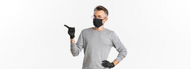 Concept of coronavirus lifestyle and quarantine image of middleaged man in glasses medical mask and