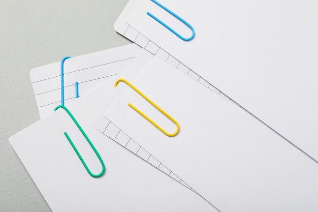 Concept of different office accessories paper with clip