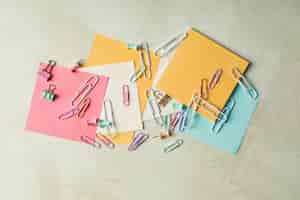 Free photo concept of different office accessories paper with clip