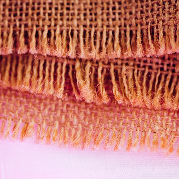Concept of fibers of burlap material in pinkness