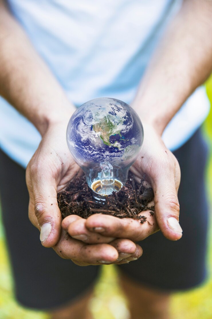 Free Photo concept hands holding earth in bulb