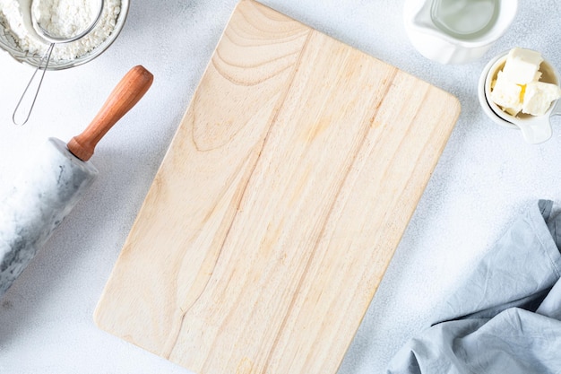 Free photo the concept of homemade baking is a marble rolling pin flour butter milk on a white background copy space top view baking concept