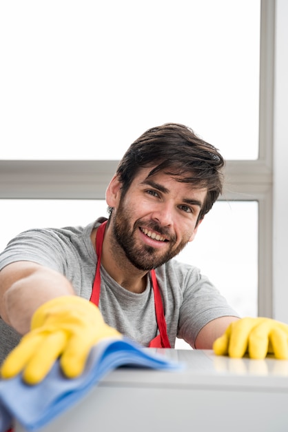 Concept of man cleaning his home