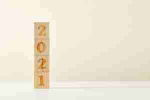 Free photo concept of a new year - wooden cubes with numbers 2021