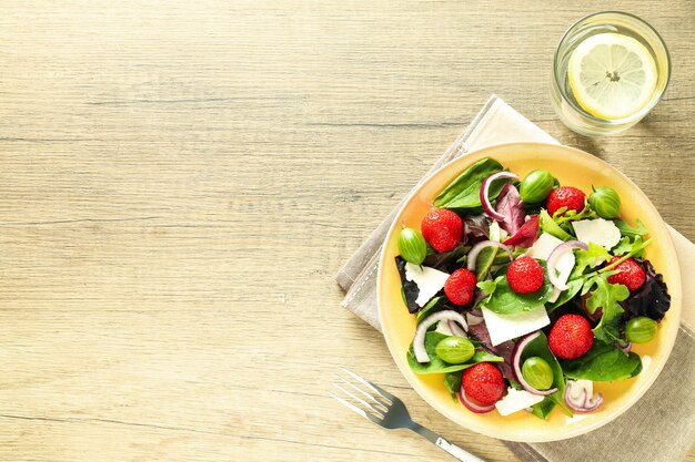 Concept of tasty food salad with strawberry space for text