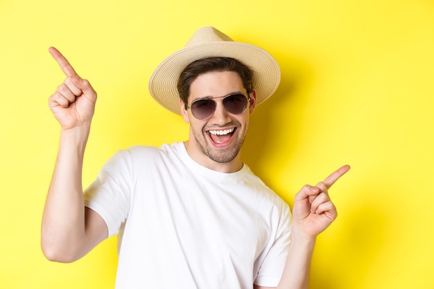 Concept of tourism and vacation closeup of man enjoying holidays on trip dancing and pointing finger...