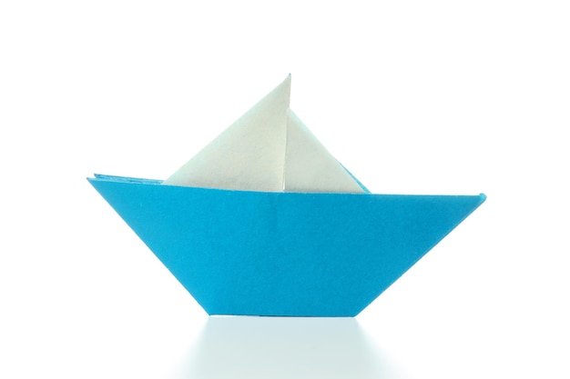 Free photo concept of travel and adventure with paper boat isolated on white background