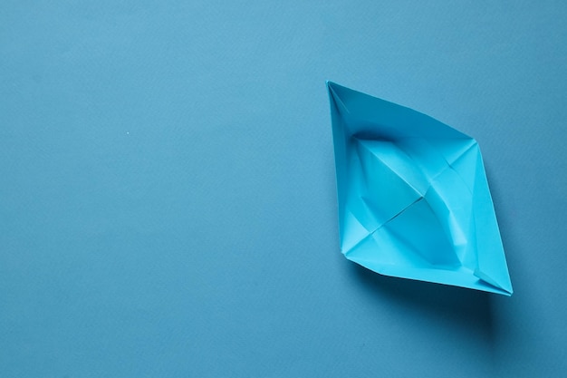 Free photo concept of travel and adventure with paper boat