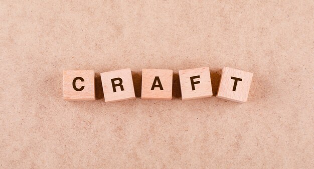 Conceptual of craft with wooden blocks with words  flat lay.