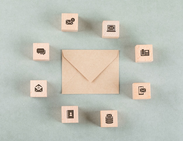 Free photo conceptual of management with wooden cubes, envelope.