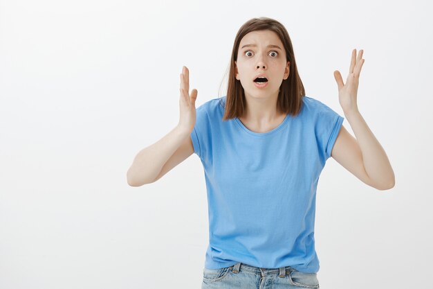 Concerned and anxious woman gasping react to something terrible, bad situation