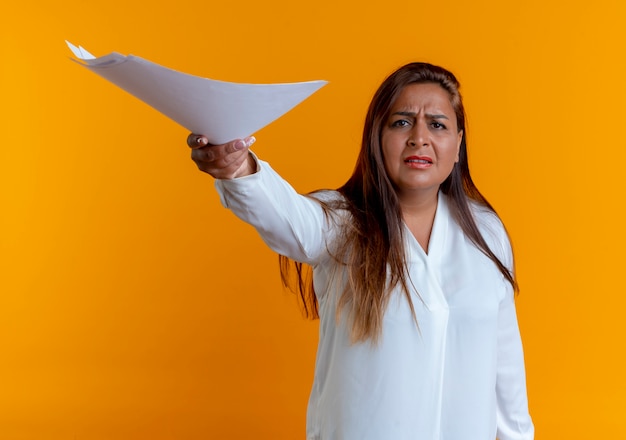 Concerned casual caucasian middle-aged woman holding out paper