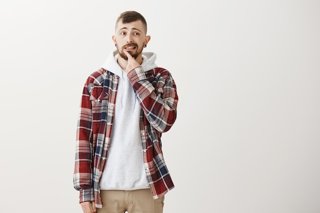 Concerned nervous man looking right thoughtful and alarmed