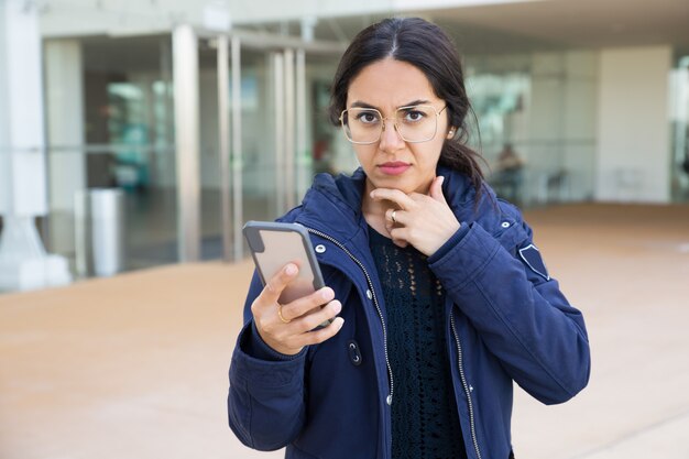 Concerned office worker chatting on phone