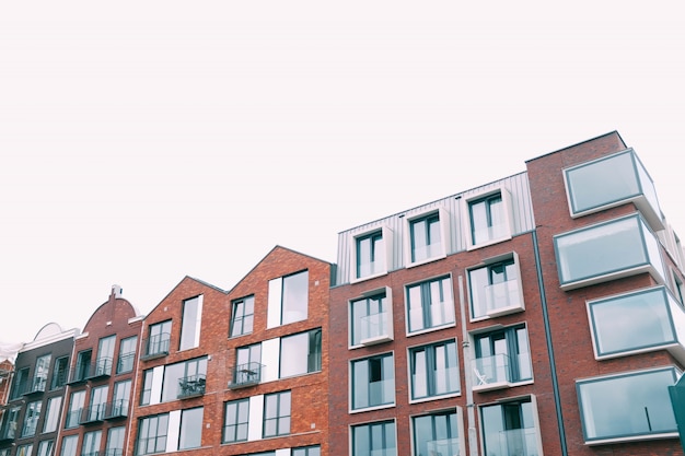 Concrete brown building under the white sky