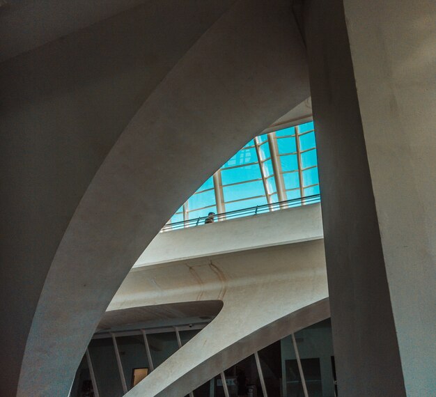 Concrete building and clear sky seen through window