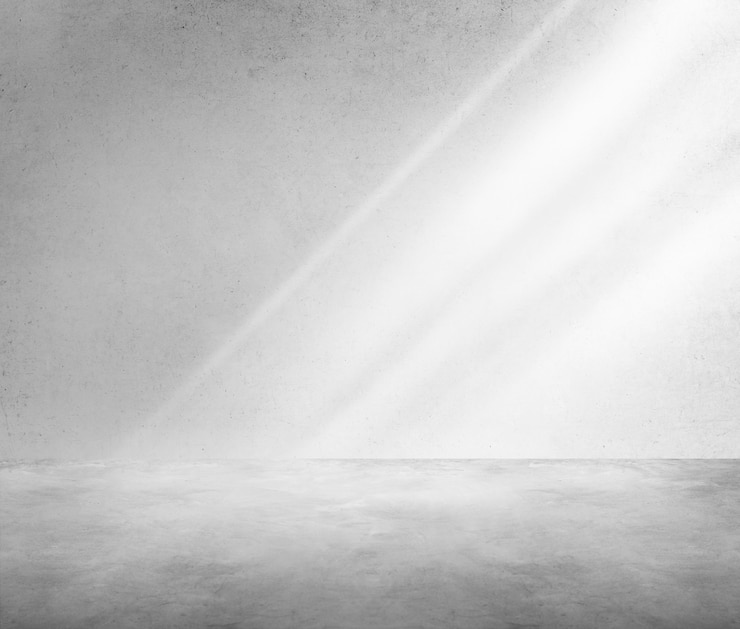 Free Photo concrete room corner shadow sunlight wallpaper concept