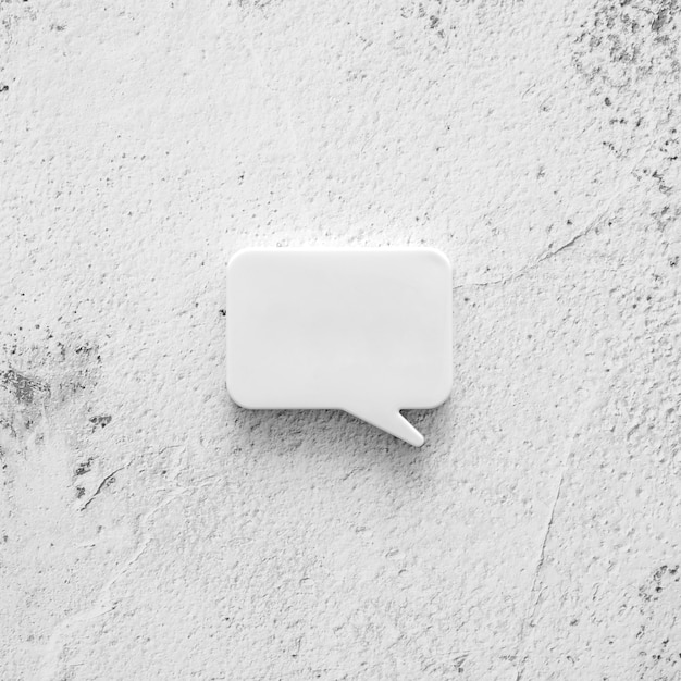 Free photo concrete surface with chat bubble