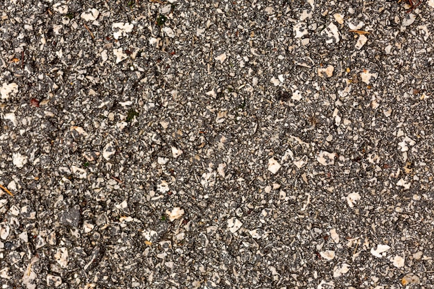 Бесплатное фото Бетонная текстура с камнями и галькой