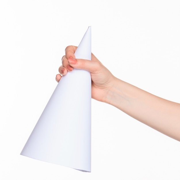 The cone in female hands on white space