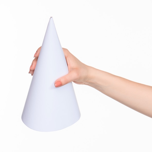 Free photo cone in female hands on white