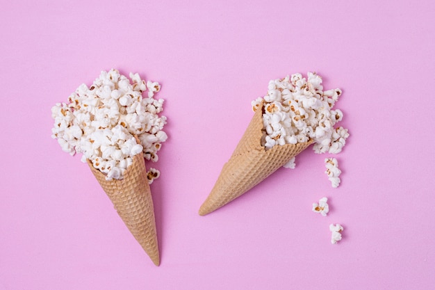 Free photo cones of ice cream filled with popcorn abstract concept