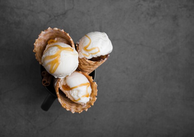 Cones with ice cream with topping
