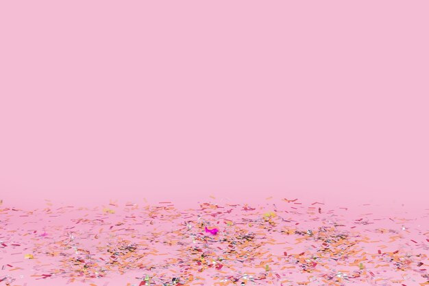 Confetti fallen on pink background